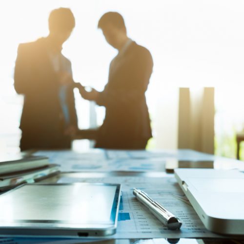 image-of-business-workplace-with-team-partners-interacting-on-background