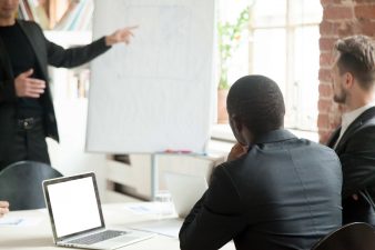 team-businessmen-listening-business-lecture-during-briefing-min